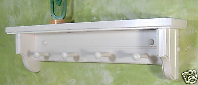 White wooden shelf for knik knack, plates / pegs  